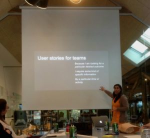 Shahina showing a slide of 'team user stories' to the DPMCOPE group